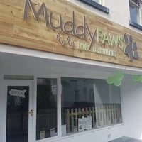 Muddy Paws Dog Grooming logo