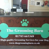 The Grooming Barn logo